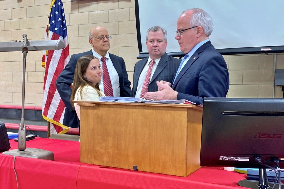 Town Meeting Select Board members and Moderator Discuss at podium