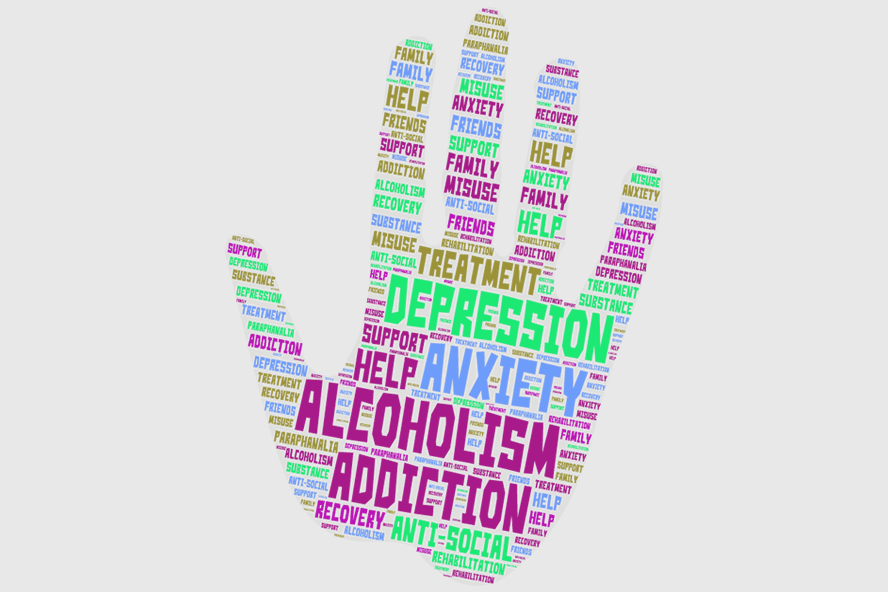 Hand image with words related to addiction