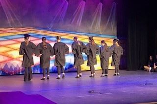 Lineup of dancers on stage