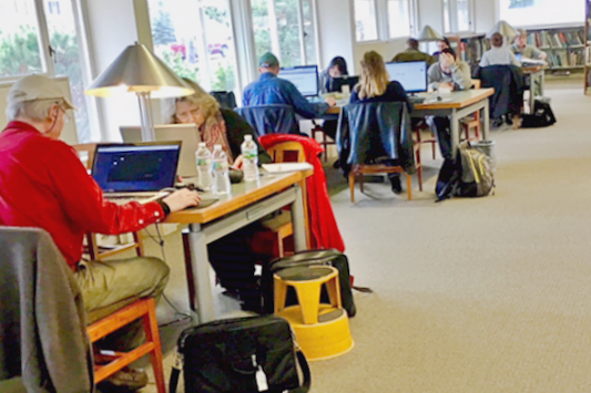 Library patrons at desks