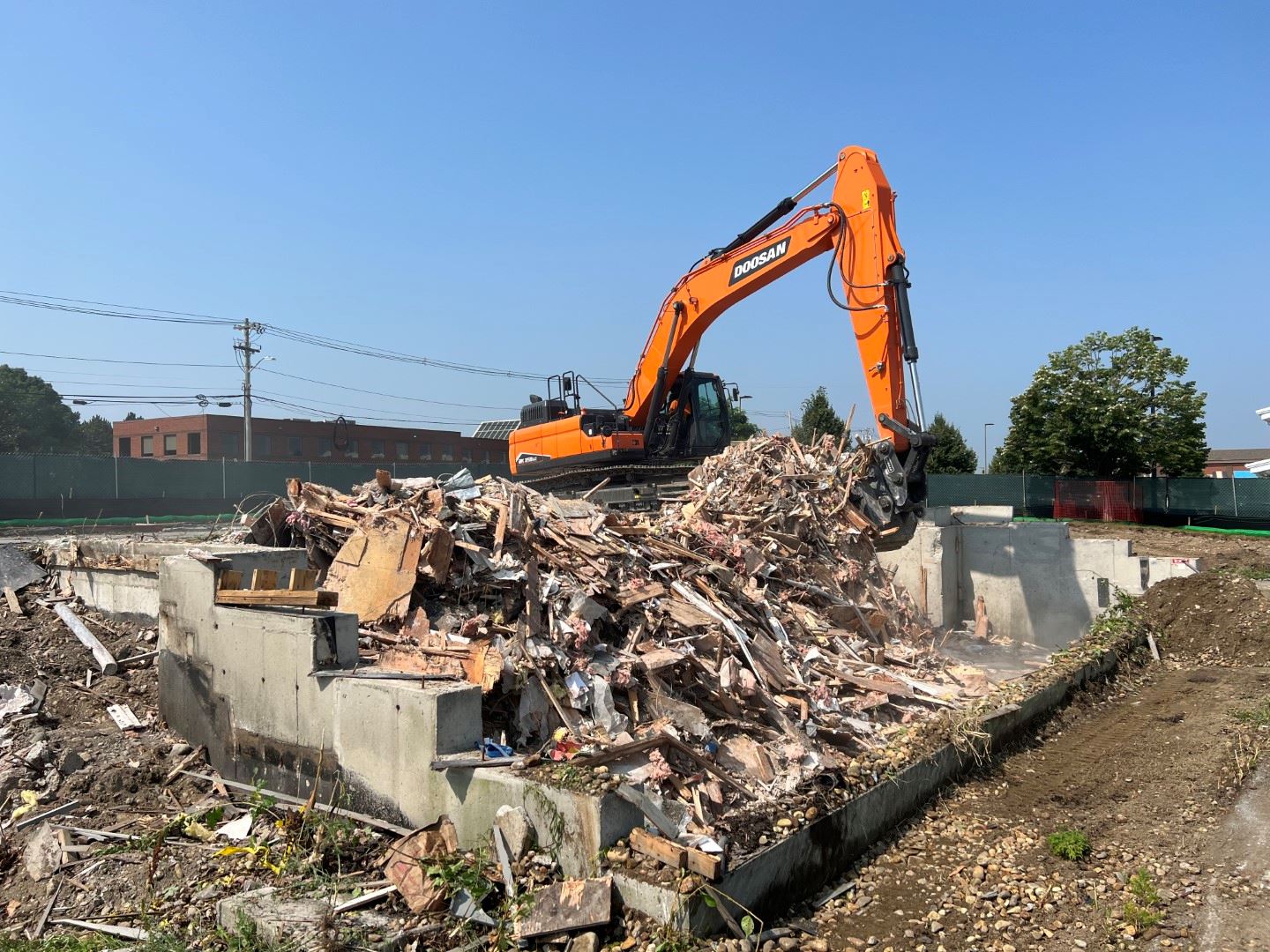 Building Demo Side view with excavator